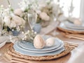 simple easter table setting with pastel plates and natural decorations, minimalist style Royalty Free Stock Photo