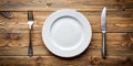 Simple Elegance An Empty Plate Fork and Knife on a Rustic Wooden Table a Stunning Still Life for Royalty Free Stock Photo