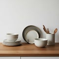 Ceramic bowls and plates with a minimalist speckled design. A Royalty Free Stock Photo