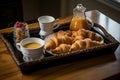 simple and elegant tray of pastries, croissants, and coffees