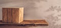 Wooden Cube Resting on a Rustic Shelf Against a Neutral Background