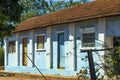 Simple farm house. Brick house, red roof, red earth farm, Brazil.