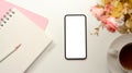 Simple feminine workspace with mockup screen on modern smartphone