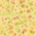 Simple floral seamless fabric and paper pattern Small muted yellow red orange brown layered flowers on a light-yellow background