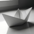 Simple folded paper boat on a reflective surface Royalty Free Stock Photo