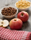 The simple food composition with apples and corn flacks Royalty Free Stock Photo