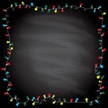 Simple frame with garland lights on a chalkboard background