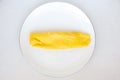 Simple french egg omelette on white background.