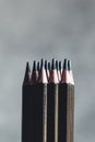Simple graphite pencils on grey background. Black pencils Royalty Free Stock Photo