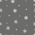 Simple grey festive seamless pattern with hand drawn white snowflakes. Christmas winter design. Falling snow. Vector