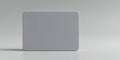 A simple grey rectangular object with rounded corners sitting on a white surface studio shot Royalty Free Stock Photo