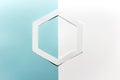Simple hand cut paper origami hexagon shape on blue white background