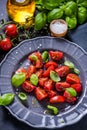 Simple and healthy dish, tomato and basil Royalty Free Stock Photo