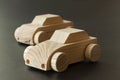 Simple home made wooden toy cars on black background. Selective focu Royalty Free Stock Photo