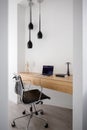 Simple home office with wooden desk