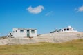 Simple houses on barren land Royalty Free Stock Photo