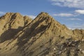 Simple houses on the ridge of a sandy mountain