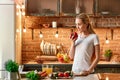 Simple ingredients prepared in a simple way. Young woman cooking in modern kitchen. Healthy lifestyle. Cooking at home Royalty Free Stock Photo