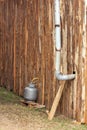 Installation of gas canister outside humble wood and chimney for smoke outlet