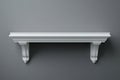 The simple interior design setting is complemented by a minimalist white shelf on a light gray wall Royalty Free Stock Photo