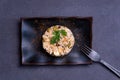 Simple italian spring risotto on dark background with bottarga on dark background. spring season italian food