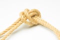 Simple knot on yellow background with esparto rope