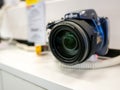 Simple Kodak DSLR camera with an aspheric zoom lens, object closeup, shallow DOF. Optics in photography, photo lens focus and zoom Royalty Free Stock Photo