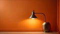 Simple lamp hangs on orange wall and illuminates it, space for t