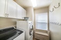 Simple laundry room interior with washing machines