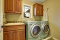 Simple laundry room with tile floor.