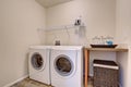 Simple laundry room with washer dryer set.