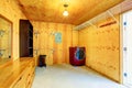 Simple laundry room with wooden trim in old farm house