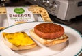 Simple Life Emerge plant based burger in on bun with melted cheese