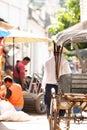 Simple life style at Tarchileik market, cycle rickshaw and laborer on the township alley. Tarchileik is a border town in the Shan