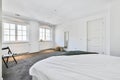 Simple light house bedroom with windows