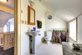 Simple light tone bathroom with vaulted ceiling