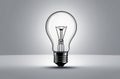 A simple lightbulb with a white light behind it, vector, outlines, with copy space