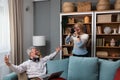 Simple living. Elderly retired couple enjoying their retirement, reminiscing entertaining in their warm home. Senior people Royalty Free Stock Photo