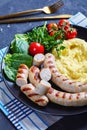 Simple meal potato aligot with sausage on a plate Royalty Free Stock Photo