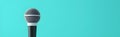 Simple Microphone on a Vibrant Turquoise Background for Presentation Royalty Free Stock Photo