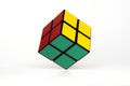 Simple mind challanging puzzle, cube hovering over white background, simplicity concept Royalty Free Stock Photo