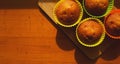 Simple mini muffins in colorful silicone bakeware. Free space. Closeup Royalty Free Stock Photo