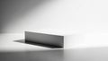 A simple and minimalist white rectangular block on a surface in monochrome lighting Royalty Free Stock Photo