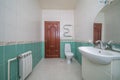 Simple mirror and ceramic sink in bathroom