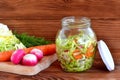 Simple mixed vegetable salad. Salad with cabbage, carrots, radish, dill and olive oil Royalty Free Stock Photo