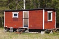 A simple and mobile summer house in red wood