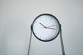 simple modern clock against white wall Royalty Free Stock Photo