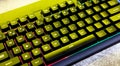 Simple modern rgb backlit gaming mechanical keyboard surface, computer keys closeup, from above, top view, angle. PC keyboard