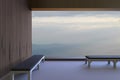 Simple modern rooms and chairs and the view outside the window in the morning and see the mountains and the sky in the morning dur