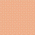 Simple modest small floral pattern of a girl\'s dress on a soft peach background Royalty Free Stock Photo